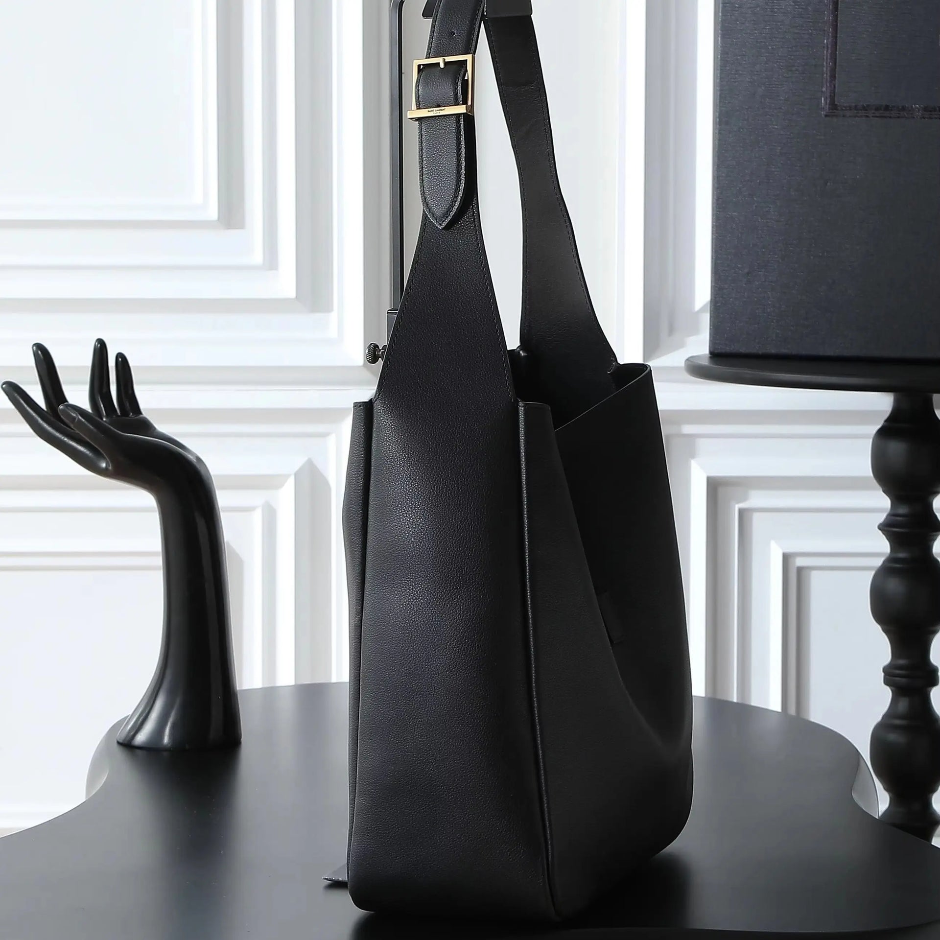 Large black soft-grain leather shoulder tote, with an adjustable wide strap and an open-top design.
