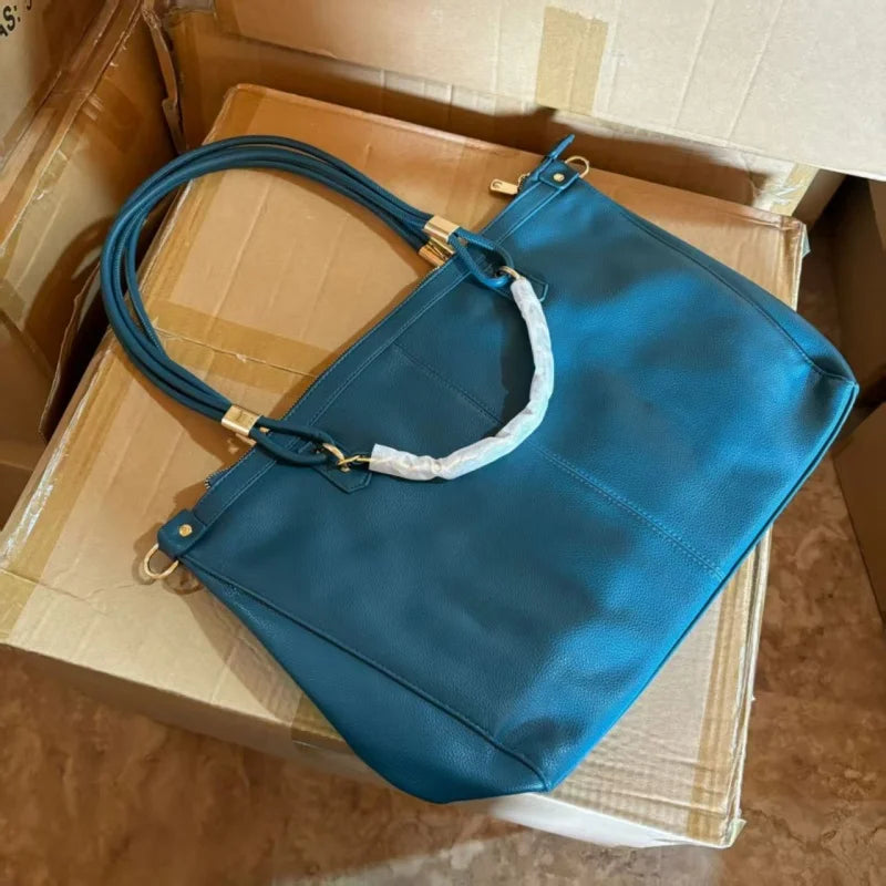 Large leather tote bag with double round handles, gold metal hardware, vertical stitching, and spacious capacity.-4